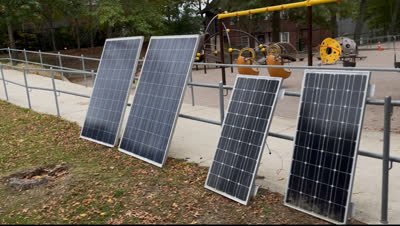 Mike and Greg testing solar panel performance on a cloudy day